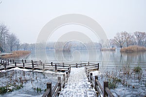 Asia China, Beijing, Chaoyang Park, winter sceneryÃ¯Â¼ÅThe wooden bridge, snow photo